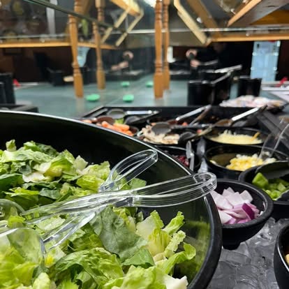 Fresh salad bar with lettuce, vegetables and toppings
